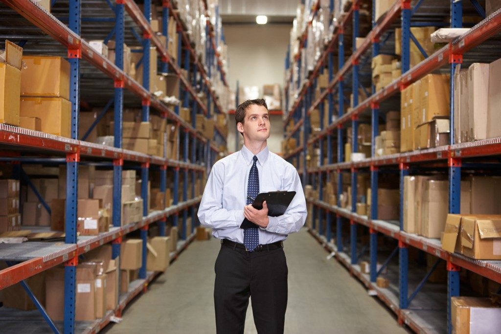 man inspecting warehouse