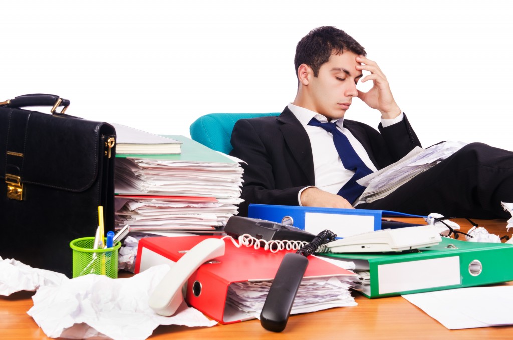 Young busy businessman at his desk