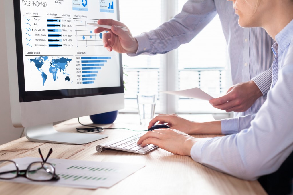 people looking at data on the computer