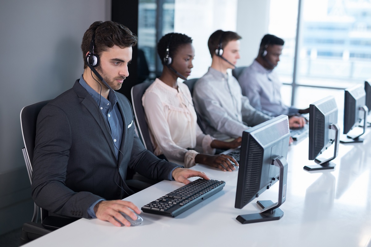 Customer service executives working at office