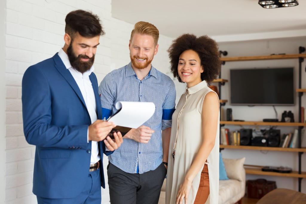 real estate agent and couple