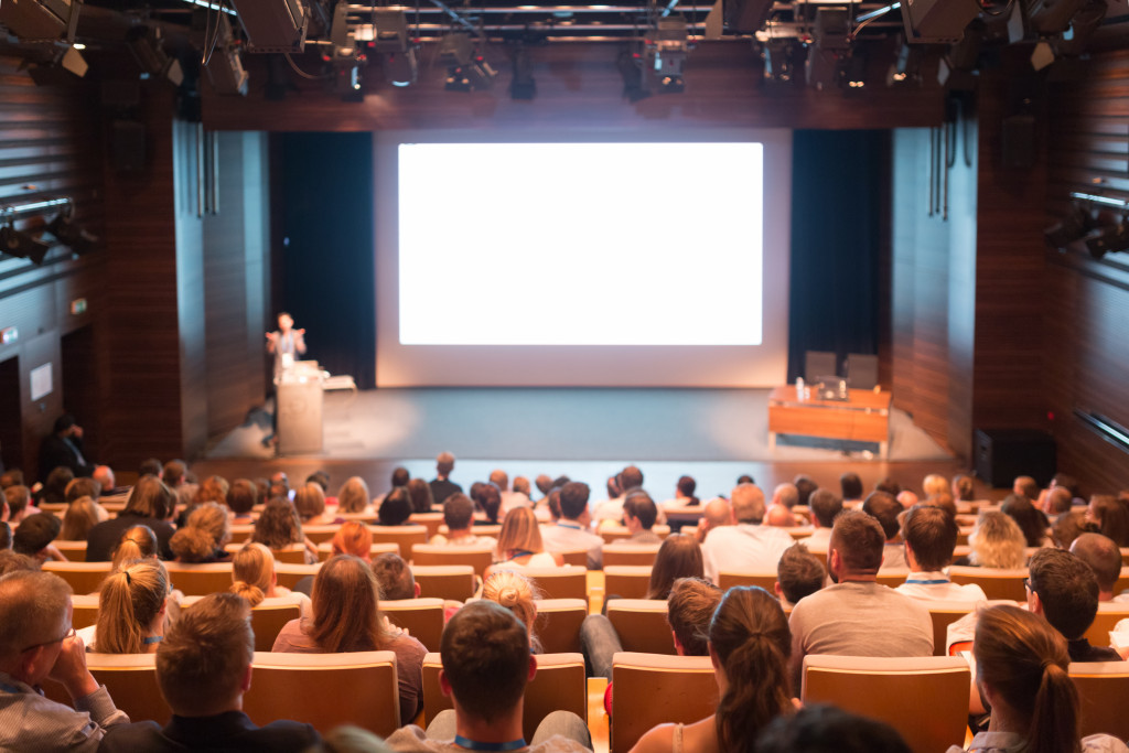 speaker at conference hall in business event