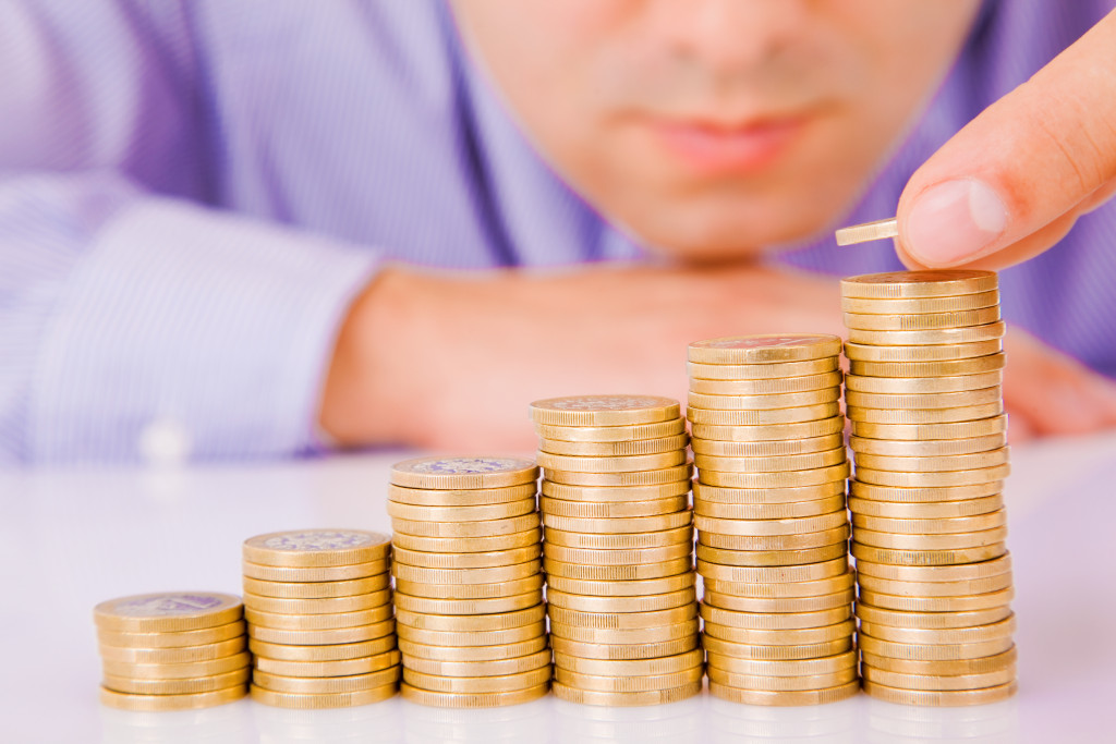 A man stacking up coins